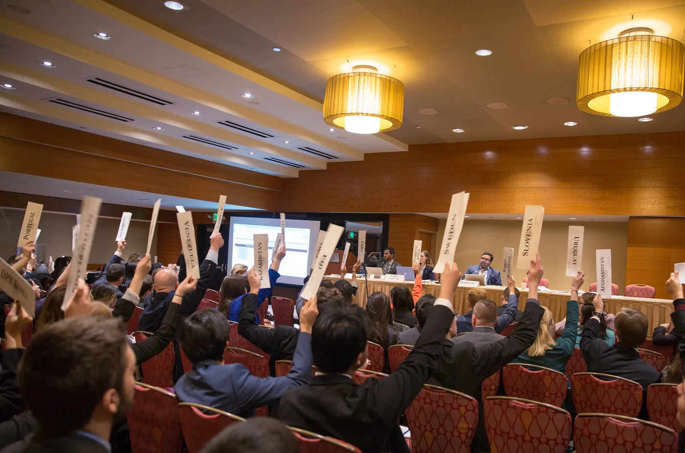 NWMUN-Seattle delegates raising country placards